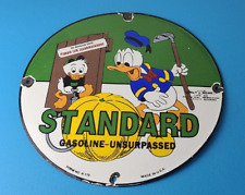 Vintage Standard Gasoline Sign - Unsurpassed Walt Disney Gas Pump Porcelain Sign picture