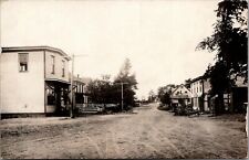 Oakdale Iowa~Main Street Looking North from Depot~Folks on Porch~1930s RPPC picture