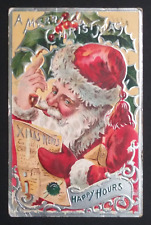 A Merry Christmas Happy Hours Santa w/ Pipe Reading News Embossed Postcard 1908 picture