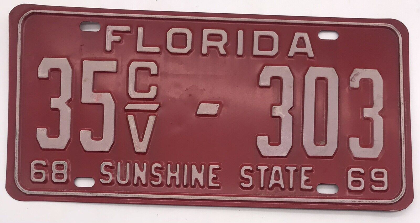 FLORIDA 1968-1969 SUNSHINE STATE LICENSE PLATE. RED