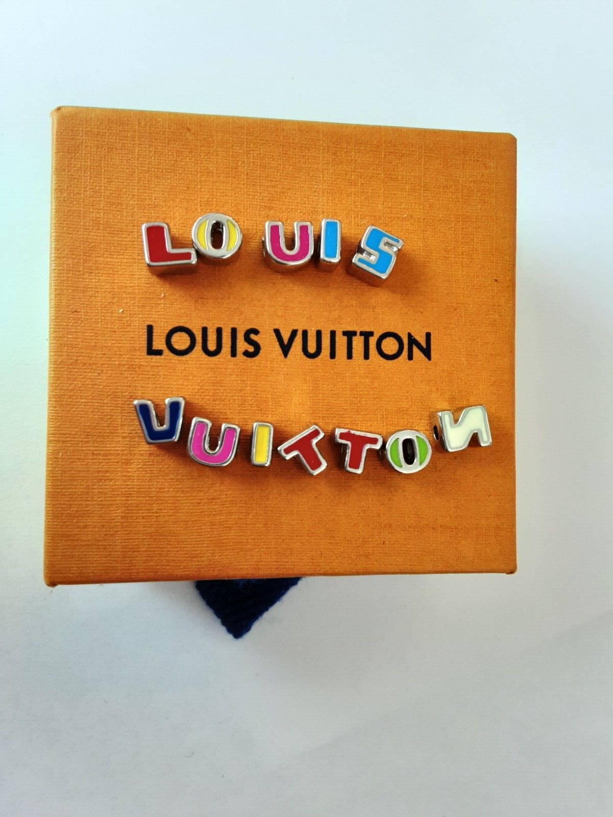 LV  multicolored metal   silver  zipper pull  letters  buttons