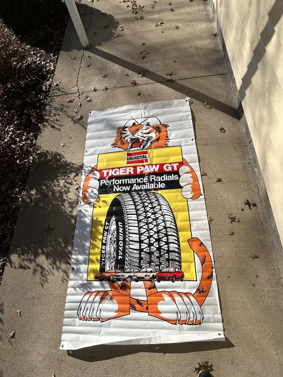1970'S UNIROYAL TIGER PAW GT TIRES SIGN / BANNER LARGE 4'X8'