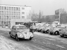An ADAC member on a traditional motorbike one in a new VW Beetle o- Old Photo picture
