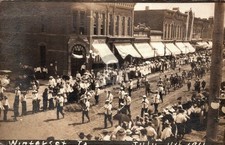 Winterset Iowa 4th July Main Street Parade Bank Harness Store RPPC Postcard COPY picture