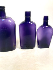 Vintage Purple Glass Whiskey Bottles, 2 EMBOSSED, 1 NOT, NOT DUG bottles picture