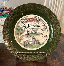 Vintage green and gold plate featuring Arkansas state landmarks. picture