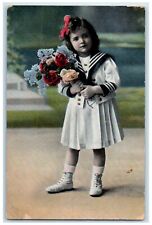 c1910's Pretty Little Girl Wearing Uniform With Holding Flowers Antique Postcard picture