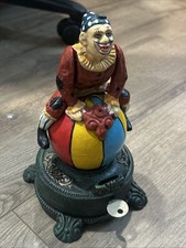 Vintage Cast iron spinning mechanical cast iron clown Acrobat bank picture