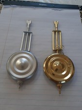 A Pair Of Kitchen Clock Pendulum Reproductions picture