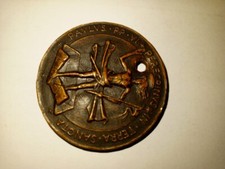 An old antique brass medallion, 1964, symbolizing the Christian religion picture