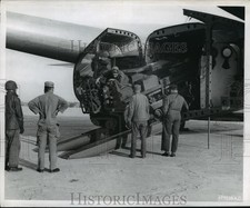 1950 Press Photo Kimpo Field, men unload a tractor from a Fairchild C-119 Packet picture