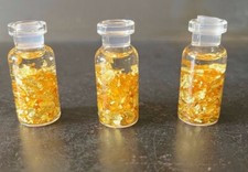 gold flakes in a bottle real gold pounded flat beautiful rich gold color 3 piece picture