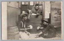 Cowboys Playing Cards Pistol Drinking Studio Real Photo Postcard RPPC c1910 picture