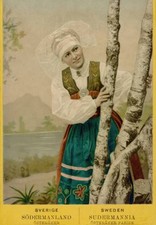 Coloured portrait photograph of a woman looking out from behind bi- Old Photo picture