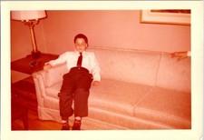 Vintage 1960s 1970s Color Photo Young Boy Sleeping on Couch Formal Attire picture
