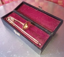 Instrument décor, vtg Trombone in casing w/red velvet material in orig. wood box picture