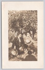 RPPC Couple Sitting Under Tree with Last Name Written on Back 1904-1918 Postcard picture