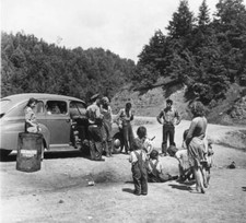 Group gathered round a car during the Great Depression in the USA Old Photo picture