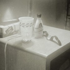 Vintage B&W Snapshot Photograph Abstract Nightstand Odd Cup Watch Tissues 1950s picture