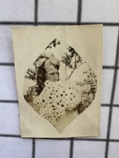 Antique 1910s Girl Huge Hair Bow Holding Daisies Heart-Shaped Snapshot picture