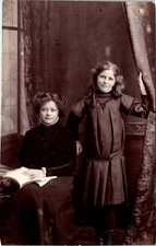 PORTRAIT OF TWO SISTERS READING  : CHRISTMAS & NEW YEARS MESSAGE : RPPC  1910 picture