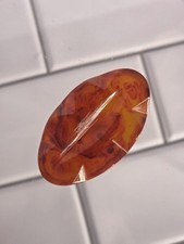 Vintage Orange Marbled Bakelite Carved Oval Jewelry Piece picture