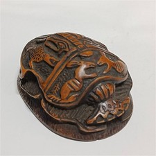 Ancient Egyptian scarab carving with intricate patterns brown and orange tones picture