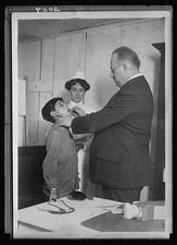 Photo:Doctor Examining Boy Nurse 1917 1920s Health Clinic picture
