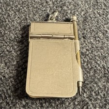 This is an antique aide-mémoire, a miniature notepad and pencil set  picture