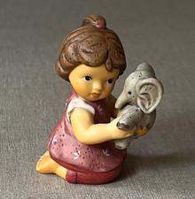 Goebel Nina Marco Porcelain Figurine Multicolor Girl Holding Elephant, 1 Pack picture