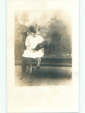 Pre-1920's rppc BLURRY DOG EATING FROM CHILD'S HAND o2286 picture
