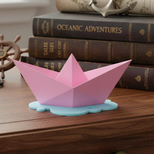 3D Printed Paper Boat Sculpture on Water Puddle picture