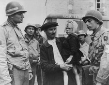Four year old French boy is taken by a relative a US Army hospital- Old Photo picture