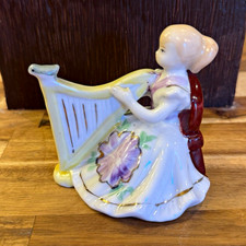 Vintage, hand-painted porcelain figurine playing harp picture