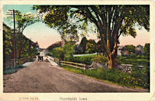 Humboldt Iowa Dirt Road Old Car Street Scene Postcard 1900s picture