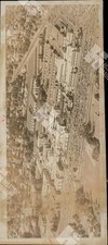1911 An aerial view of a campus with multiple buildings and a large parking lot picture