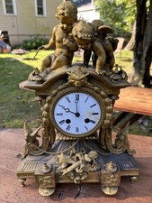 Antique Clock Metal Figural with Cherub and Birds. picture