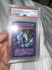 2009 YU-GI-OH Dragon Master Knight RP02-EN097 PSA 7 picture