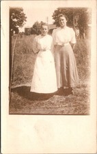 Two Young Women Posing Outdoors Full Length Rural Scene Postcard Real Photo RPPC picture