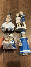 Porcelain Children Figurines Set of 4 Multicolor Glossy Finish picture