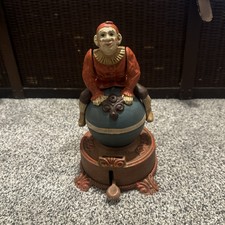 J & E Stevens Replica? Clown on Globe Cast Iron Mechanical Coin Bank Spinning picture