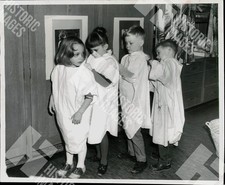 1968 Four children in paint smocks at a kindergarten classroom picture