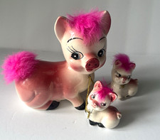 vintage mid-century Ceramic Chained Pig Figurines featuring whimsical pink faux picture