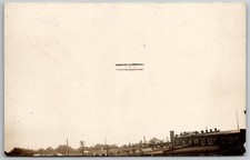 Vintage RPPC Biplane Airplane Flight Over Town Real Photo Postcard picture