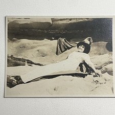 Antique RPPC Real Photograph Postcard Beautiful Young Woman Laying In Sand Hat picture