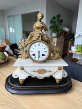 Antique 19th-century French figural mantel clock with a white marble picture