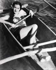 Maria Montez in Hawaiian style outfit lies in canoe 8x10 inch photo picture