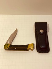 Vintage 1986 Buck 110 Folding Hunter Knife USA Brass Wood Leather Sheath picture