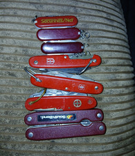 Lot of 7 Red Swiss-Style Pocketknives Multi-Blade Corkscrew Slipjoint picture