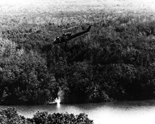 River Patrol Huey Helicopter fires rocket at enemy 8x10 Vietnam War Photo 771 picture